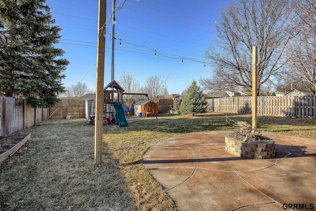 view of yard featuring a fenced backyard and a playground