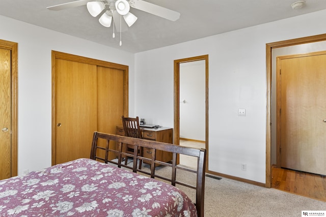 bedroom with carpet flooring, baseboards, a closet, and ceiling fan