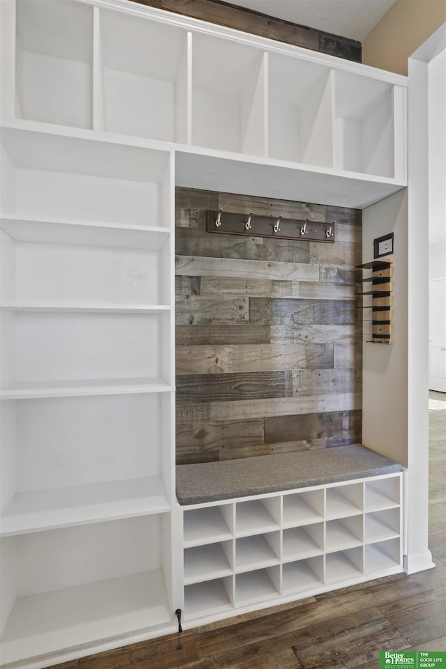 mudroom featuring dark wood-style flooring