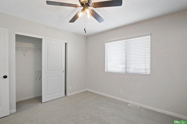 unfurnished bedroom featuring visible vents, baseboards, a closet, and carpet flooring