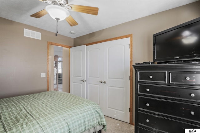 bedroom featuring a closet, visible vents, and ceiling fan