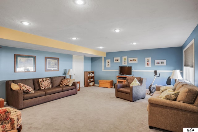 carpeted living room featuring recessed lighting