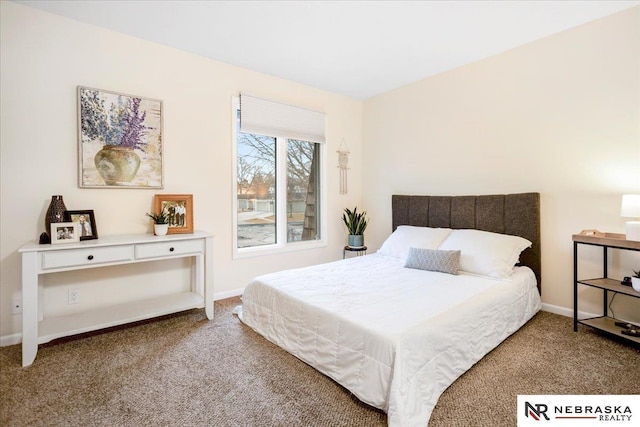 carpeted bedroom with baseboards