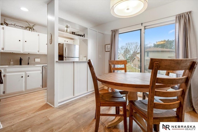 dining room featuring light wood-style floors