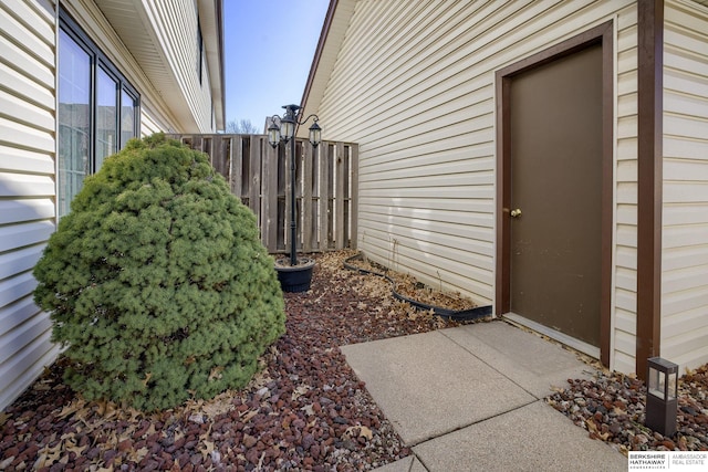 view of home's exterior with fence