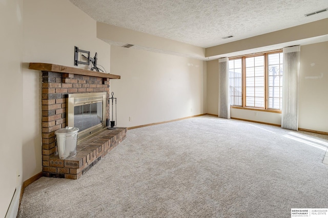 unfurnished living room featuring visible vents, carpet flooring, a fireplace, and baseboards