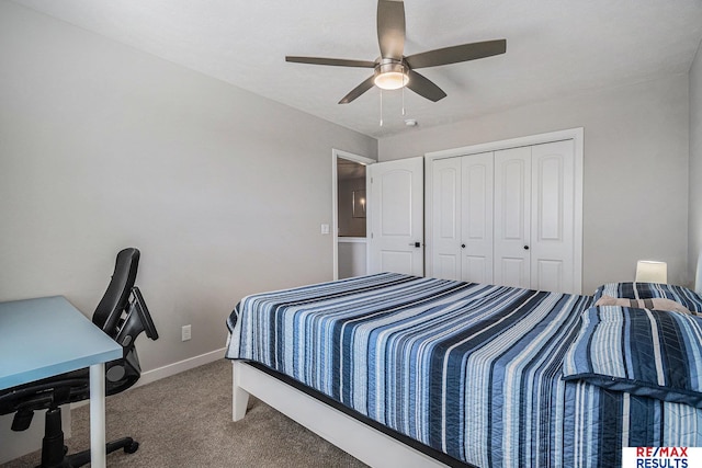 carpeted bedroom with a closet, baseboards, and a ceiling fan