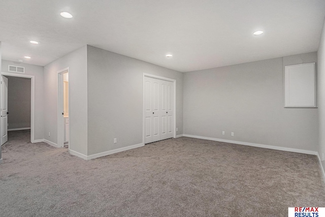 interior space with visible vents, recessed lighting, a closet, carpet flooring, and baseboards