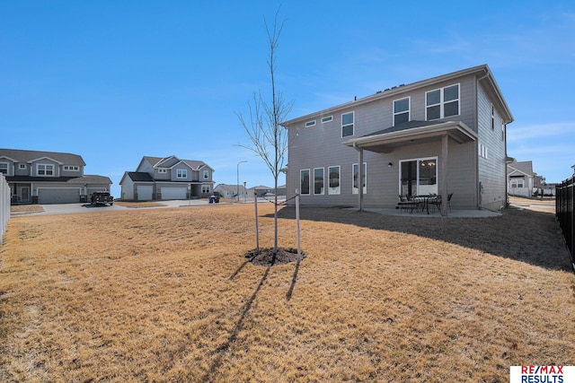 back of house with a patio area and fence