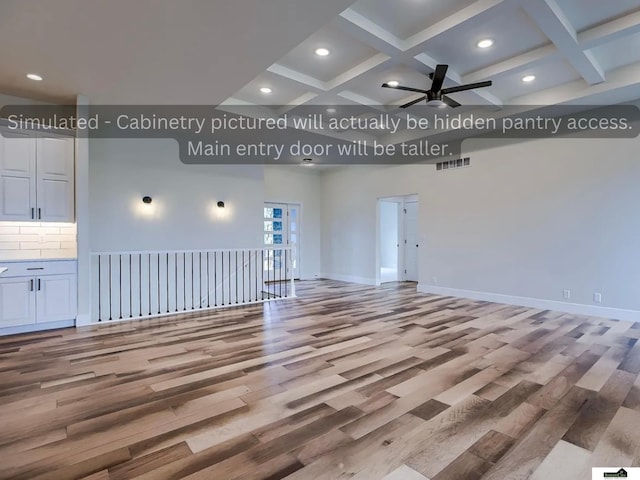 unfurnished living room featuring coffered ceiling, baseboards, ceiling fan, and wood finished floors