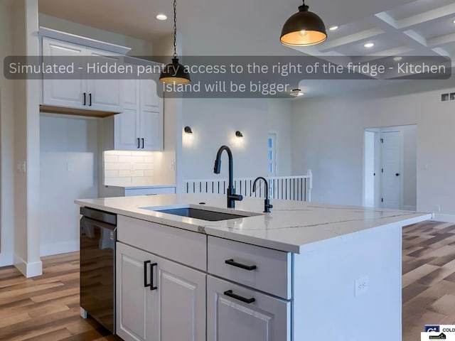 kitchen featuring dishwashing machine, light wood finished floors, a sink, white cabinets, and tasteful backsplash