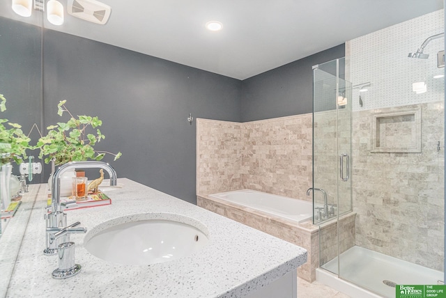 bathroom with a sink, visible vents, a stall shower, and a bath