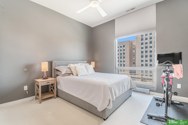 bedroom featuring visible vents, baseboards, carpet floors, and ceiling fan