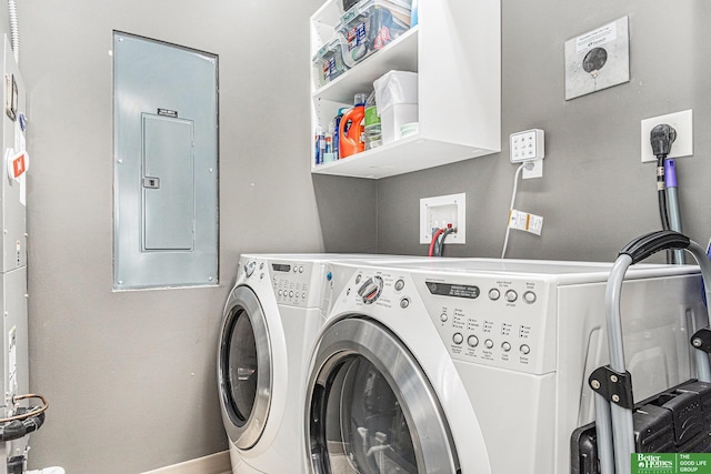 laundry room with electric panel, baseboards, separate washer and dryer, and laundry area