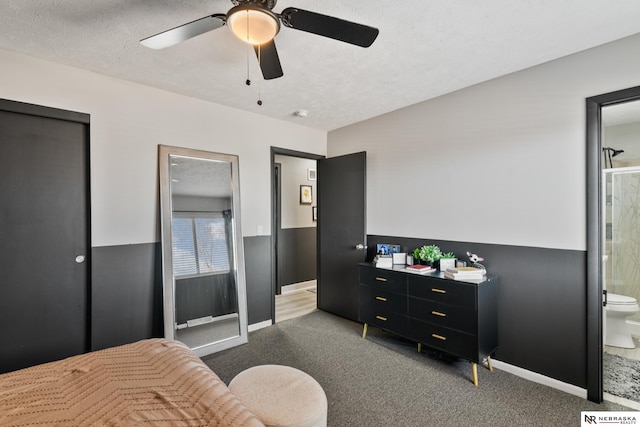 10230 Weir St, Ralston, NE 68127 - carpeted bedroom featuring a ceiling fan, ensuite bathroom, and a textured ceiling