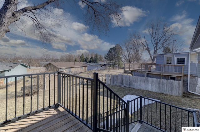 10230 Weir St, Ralston, NE 68127 - wooden terrace with fence and a residential view