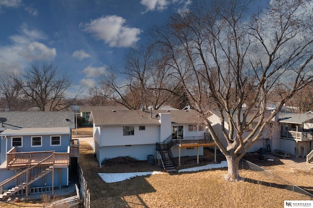10230 Weir St, Ralston, NE 68127 - rear view of property featuring a residential view, stairs, a deck, and roof with shingles