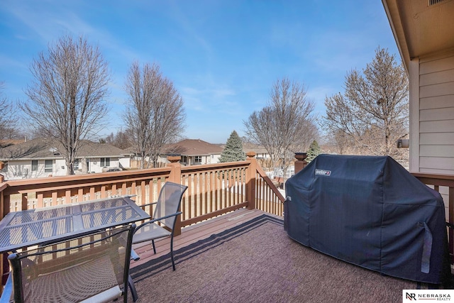 exterior space with outdoor dining area, a residential view, and area for grilling