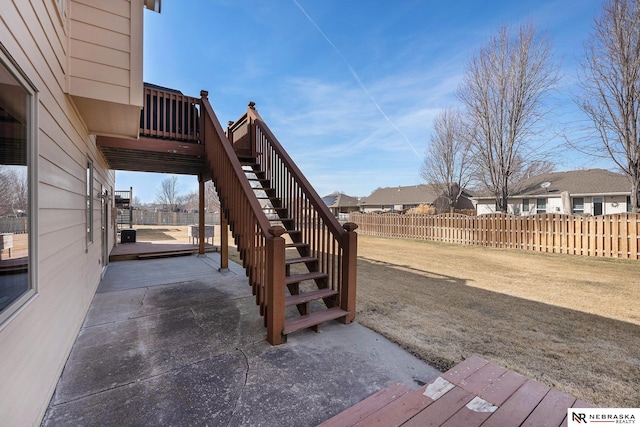 exterior space featuring a patio, stairway, and fence