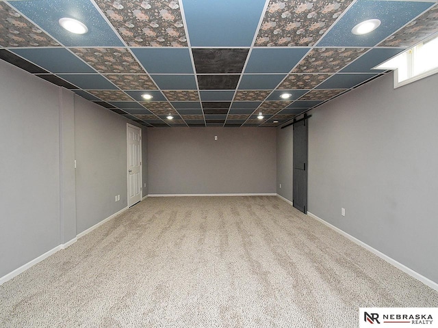 basement with carpet flooring, recessed lighting, baseboards, and a drop ceiling