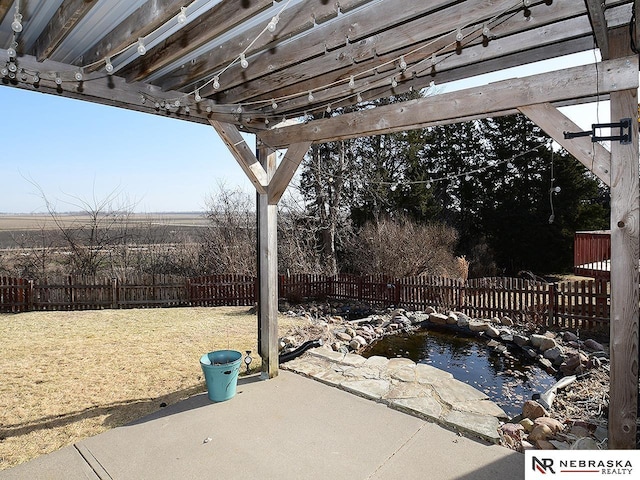 view of patio / terrace with a pergola and a fenced backyard