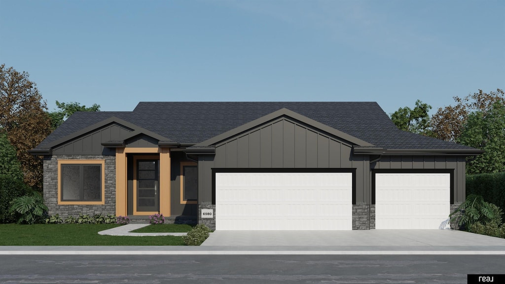 view of front of property with stone siding, board and batten siding, concrete driveway, a front yard, and a garage