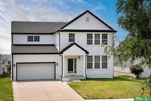 view of front facade with an attached garage, concrete driveway, a front lawn, and a shingled roof