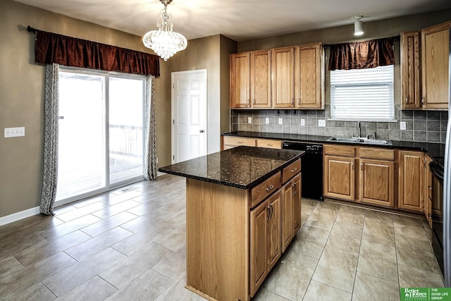 kitchen with a sink, decorative backsplash, plenty of natural light, and dishwasher