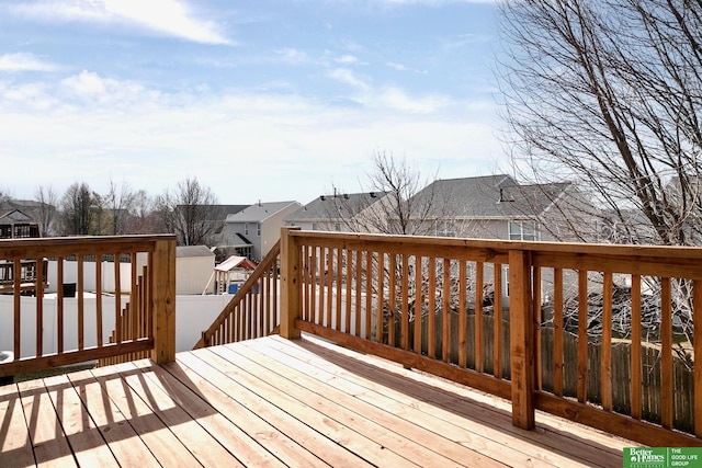 wooden terrace with a residential view