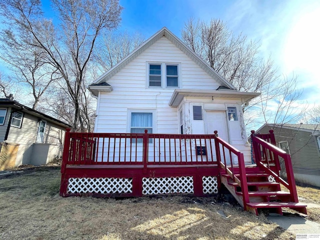 back of property featuring a deck