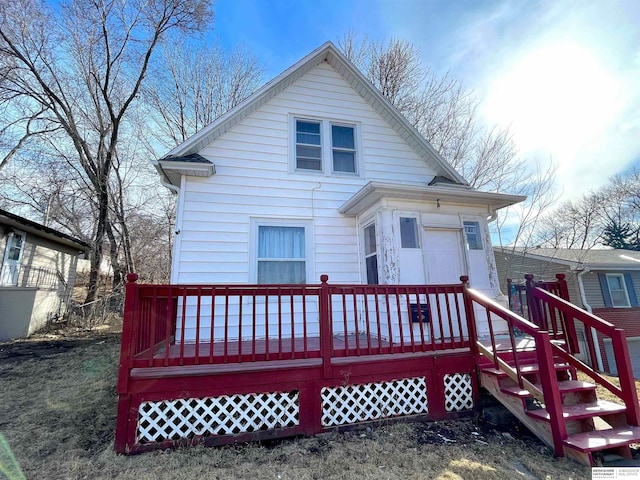 rear view of house with a wooden deck