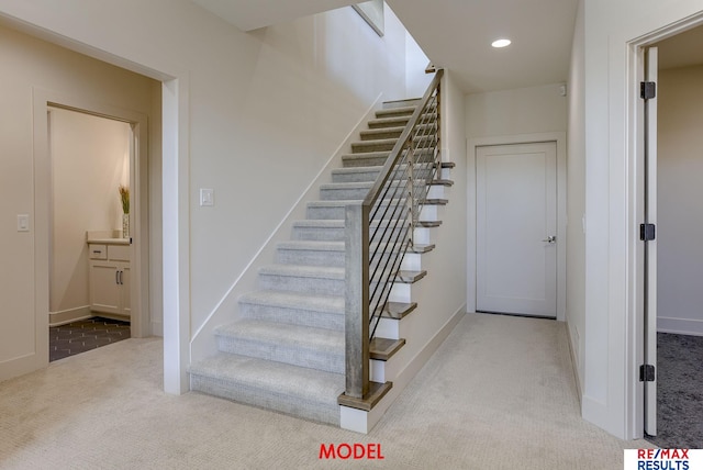 stairs featuring recessed lighting, baseboards, and carpet floors