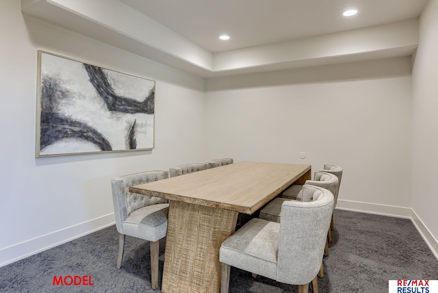 dining room with dark colored carpet, baseboards, and recessed lighting