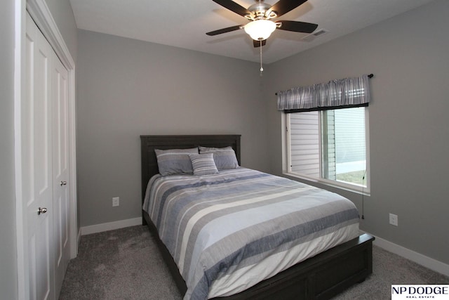 carpeted bedroom with visible vents, baseboards, and a ceiling fan