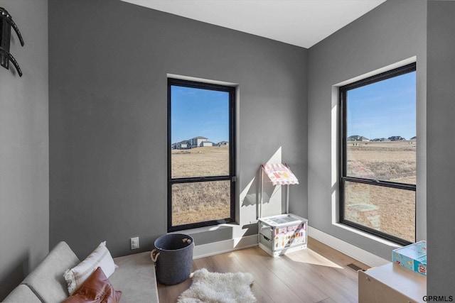 17205 Sarah St, Bennington, NE 68007 - living area with visible vents, baseboards, and wood finished floors
