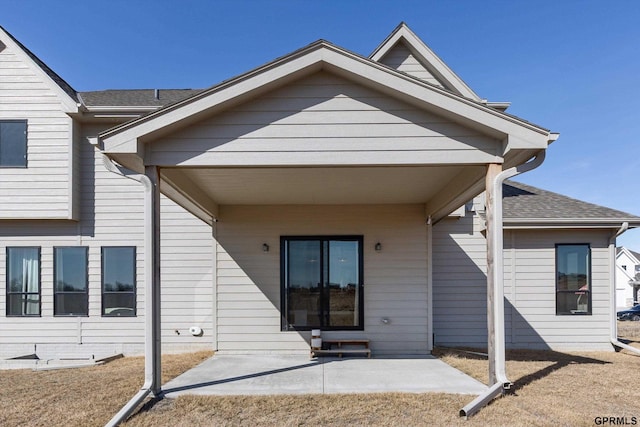 17205 Sarah St, Bennington, NE 68007 - exterior space with a patio and roof with shingles