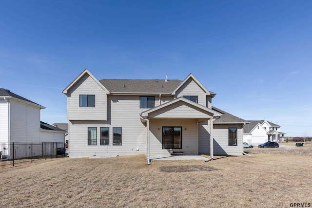 17205 Sarah St, Bennington, NE 68007 - back of property with a patio, a yard, fence, and a shingled roof