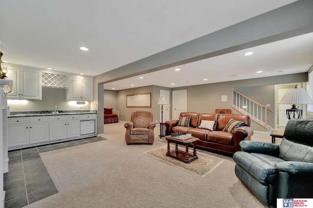 living area featuring tile patterned flooring, recessed lighting, wet bar, and stairs