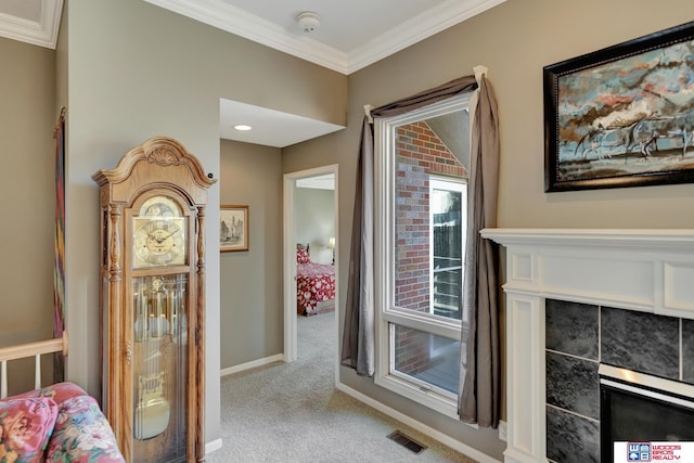 corridor featuring light carpet, visible vents, crown molding, and baseboards