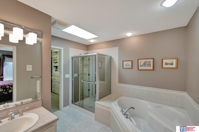 bathroom featuring tile patterned flooring, visible vents, a garden tub, a stall shower, and vanity