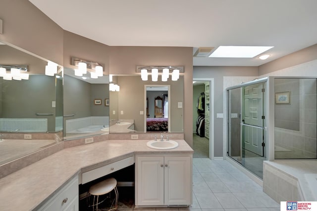 ensuite bathroom with visible vents, a stall shower, ensuite bath, a skylight, and tile patterned flooring