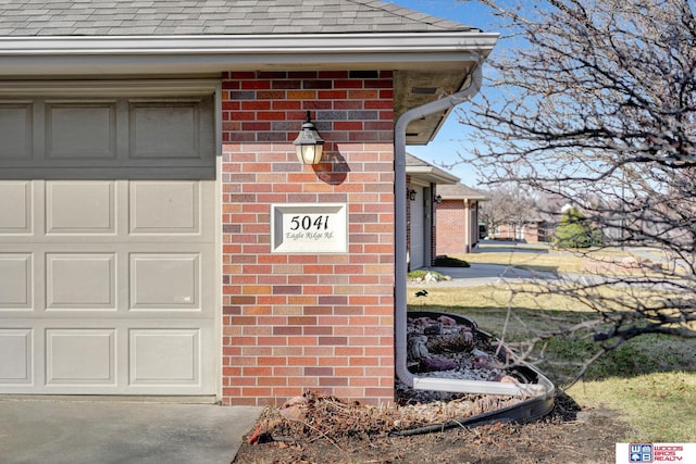 exterior details featuring brick siding