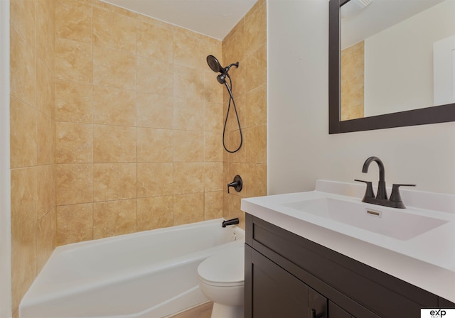 bathroom featuring vanity, toilet, and shower / tub combination