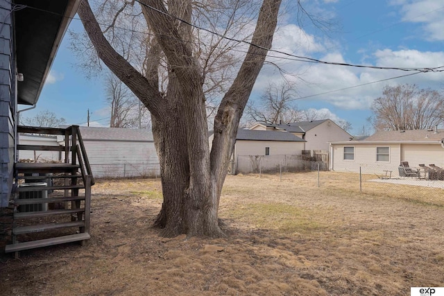 view of yard featuring stairway and fence