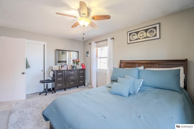 bedroom featuring light carpet and ceiling fan