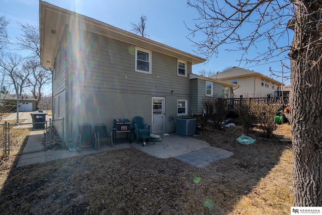 rear view of property featuring a patio, cooling unit, and fence