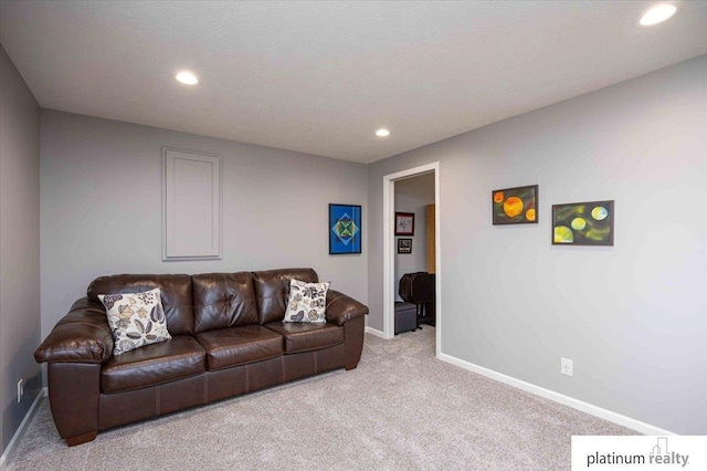 living area featuring light carpet, baseboards, and recessed lighting