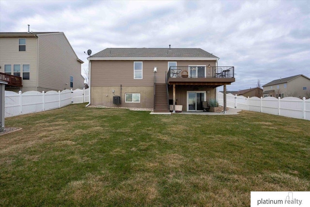 rear view of property with a patio, a deck, a fenced backyard, and a lawn