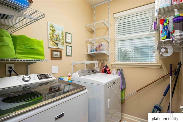 laundry area featuring washing machine and dryer and laundry area