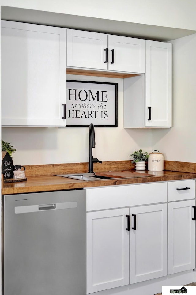 bar with a sink and stainless steel dishwasher